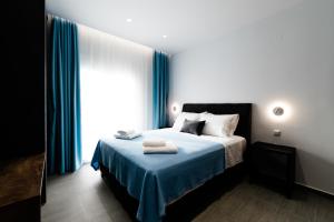 Postel nebo postele na pokoji v ubytování Athena Center Apartments