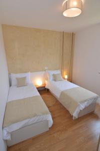 Llit o llits en una habitació de Hotel Natura Vilanija