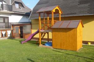 a playground with a slide and a play structure at Apartment Gyenesdias 3 in Gyenesdiás