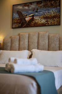 Postel nebo postele na pokoji v ubytování VM Resort & SPA