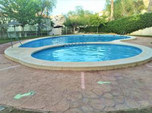 The swimming pool at or close to Townhouse with bbq and pools - Costa Hispania