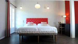 Letto o letti in una camera di Hotel Agian - Maison Bonnet