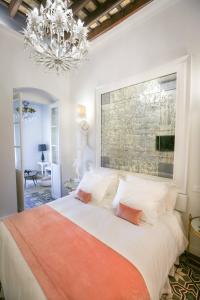 A bed or beds in a room at DONDE DUERME EL GUADIANA