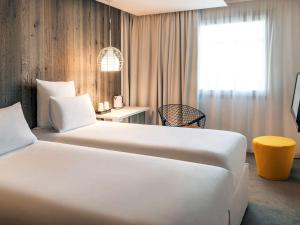 Letto o letti in una camera di Mercure Valence