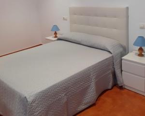 Postel nebo postele na pokoji v ubytování Apartamento playa da Ribeira