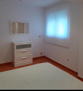 Postel nebo postele na pokoji v ubytování Apartamento playa da Ribeira