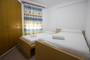 Postel nebo postele na pokoji v ubytování Style Apartment Patacona Beach segunda linea + 9 fotografií