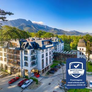 an aerial view of a hotel with mountains in the background at Nosalowy Park Hotel & Spa in Zakopane