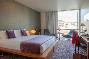 Cama o camas de una habitación en D Hotel