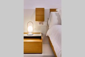 A bed or beds in a room at Pop Art, 2BD ground Central Apartment