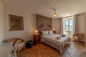 Postel nebo postele na pokoji v ubytování San Leo Albergo Diffuso