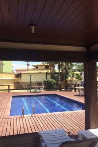 Swimmingpoolen hos eller tæt på Casa de praia Família Ramos