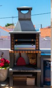 a lego pizza oven sitting on top of a building at GreenEscapes I in Porto Covo