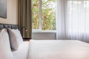 Postel nebo postele na pokoji v ubytování Žilvinas Hotel