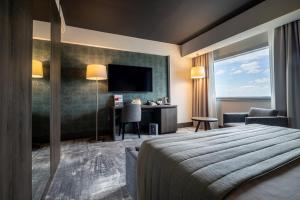 Postel nebo postele na pokoji v ubytování Hotel Osijek