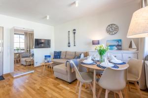 Televízia a/alebo spoločenská miestnosť v ubytovaní Ambria Apartments Rose
