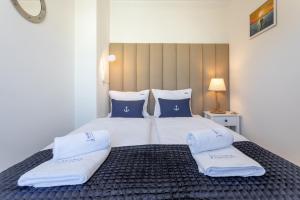 Posteľ alebo postele v izbe v ubytovaní Ambria Apartments Rose