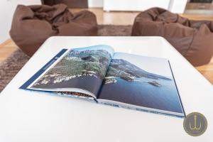an open book on a white table at Ancora 1 in Budva