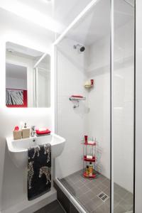 a bathroom with a sink and a shower at Yugo Explore - Arran House in Edinburgh