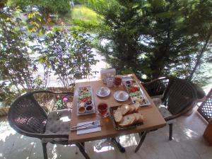 a table with plates of food on it at NEW BEYLERBEYİ HOTEL in Istanbul