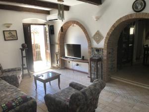 a living room with a couch and a coffee table at Casa Vacanze Crocevia in Badolato