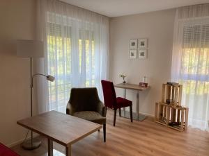 Posezení v ubytování Gästehaus zum Weintraum