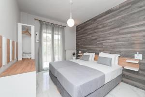 Een bed of bedden in een kamer bij Blue View Apartments