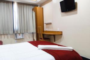 Postel nebo postele na pokoji v ubytování Capri Hotel