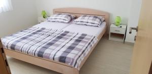 Postel nebo postele na pokoji v ubytování ABC Apartmani
