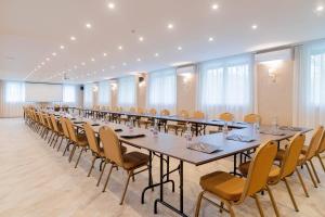 a conference room with a long table and chairs at The Hotel Unforgettable - Hotel Tiliana by Homoky Hotels & Spa in Budapest +37 photos