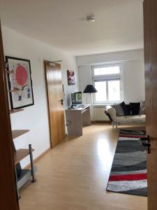 a living room with a couch and a table at Luise in Obernkirchen