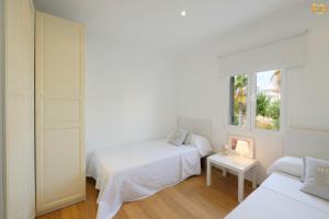 Ένα ή περισσότερα κρεβάτια σε δωμάτιο στο Can Picafort Auca