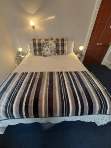 Postel nebo postele na pokoji v ubytování Lawriestone Guest House