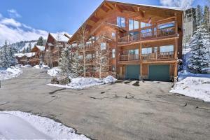 a log home in the snow with a driveway at Slopeside Sanctuary - Penthouse Less Than 1 Mi to Lifts! in Winter Park