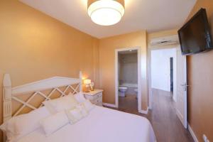 Ein Bett oder Betten in einem Zimmer der Unterkunft Casa Mediterraneo