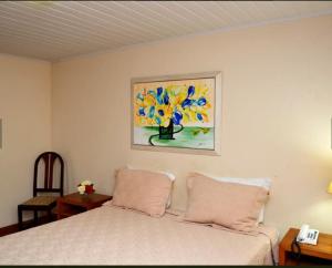 
Cama ou camas em um quarto em Hotel Girassol
