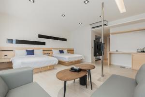 Postel nebo postele na pokoji v ubytování Ai Mei Homestay
