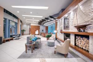 a lobby with couches and chairs and a fireplace at Club Wyndham National Harbor in National Harbor