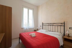 Cecio 5 Terre Rooms tesisinde bir odada yatak veya yataklar