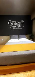 a bed with a sign on top of it at Bucanaan hostel boutique in Cordoba