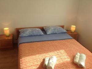 En eller flere senger på et rom på Apartments & Rooms Elda