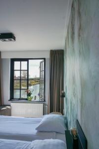 Cama ou camas em um quarto em "Het Wapen Van Willemstad"