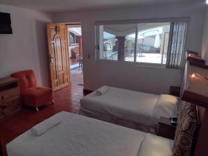 Postel nebo postele na pokoji v ubytování Hotel Leyenda del Tepozteco