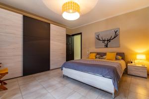 A bed or beds in a room at Skalina