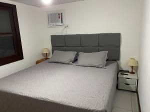 En eller flere senge i et værelse på Casa de praia Família Ramos + 34 billeder