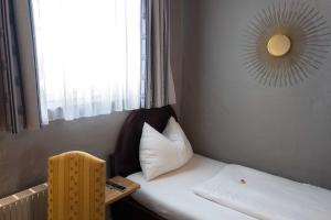 Voodi või voodid majutusasutuse Altstadt Hotel Stadtkrug toas