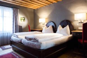 Voodi või voodid majutusasutuse Altstadt Hotel Stadtkrug toas