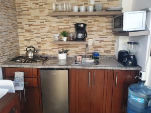 a kitchen with a sink and a counter top at depa #5 recién remodelado en planta alta in Zacatecas