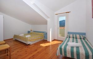 Postel nebo postele na pokoji v ubytování Apartman Tudor