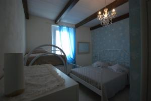 מיטה או מיטות בחדר ב-B&B Vittorio Emanuele